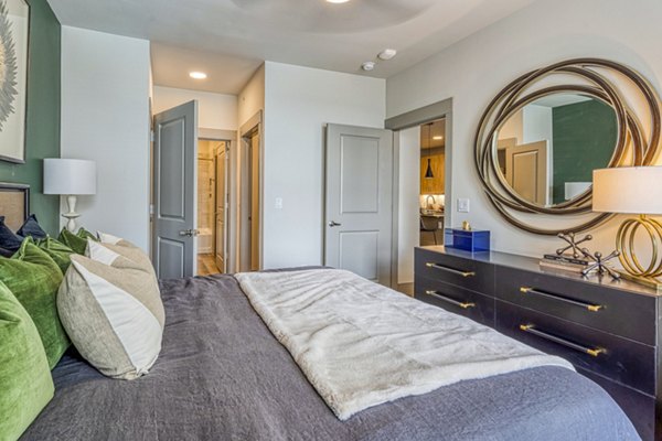 Cozy bedroom with modern decor at The Banks of Springdale Apartments