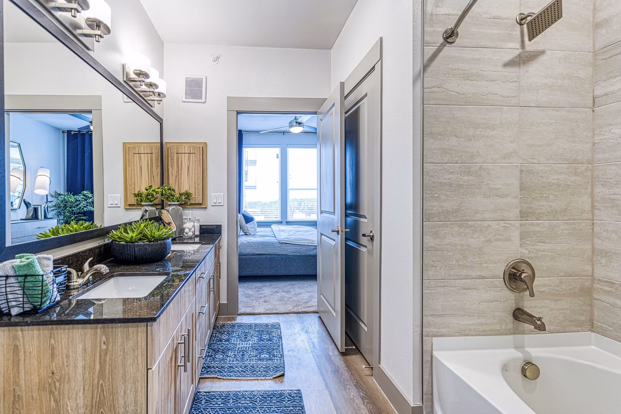 Elegant bathroom with marble countertops at The Banks of Springdale Apartments