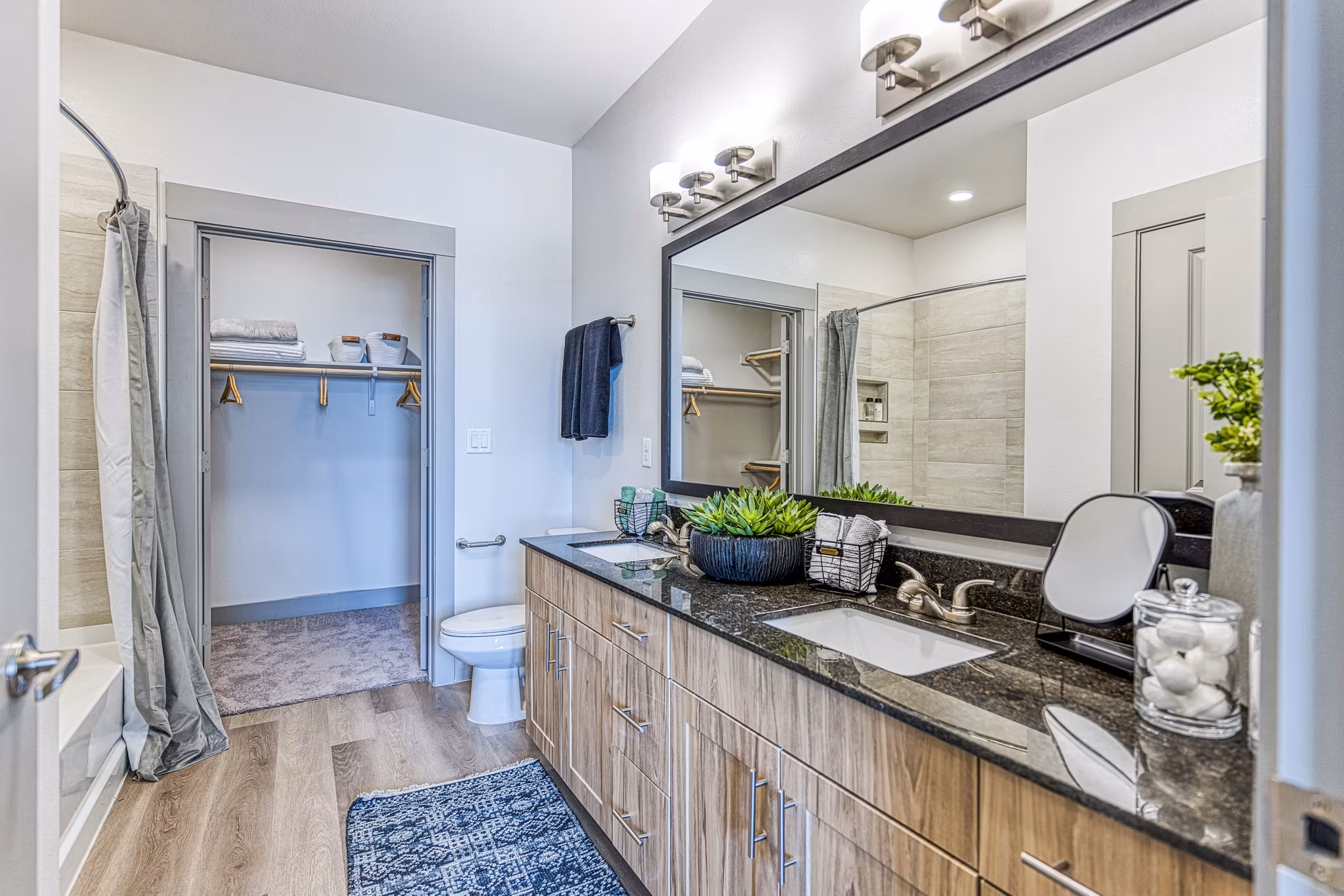 Modern bathroom with marble finishes at The Banks of Springdale Apartments offering luxurious living experience