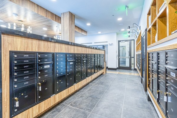 Mail room with secure package lockers at The Banks of Springdale Apartments