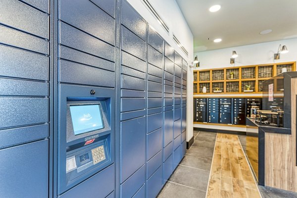 Mail room with parcel lockers at The Banks of Springdale Apartments for convenient package pickup for residents