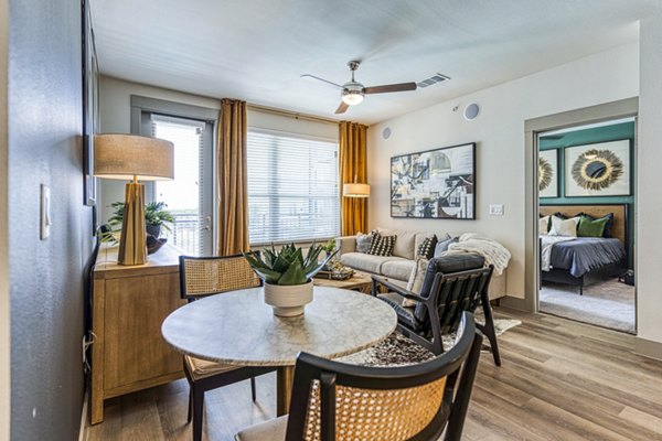 Dining room featuring elegant decor and modern lighting at The Banks of Springdale Apartments