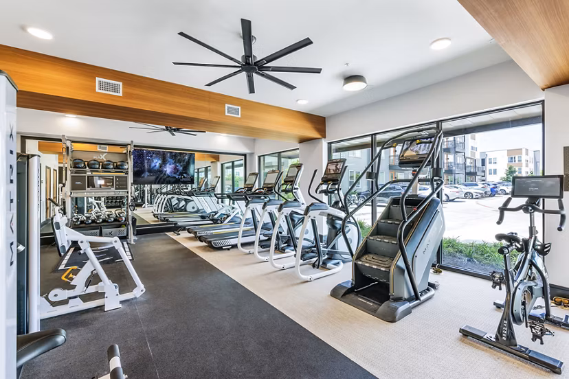 State-of-the-art fitness center with modern equipment at The Banks of Springdale Apartments