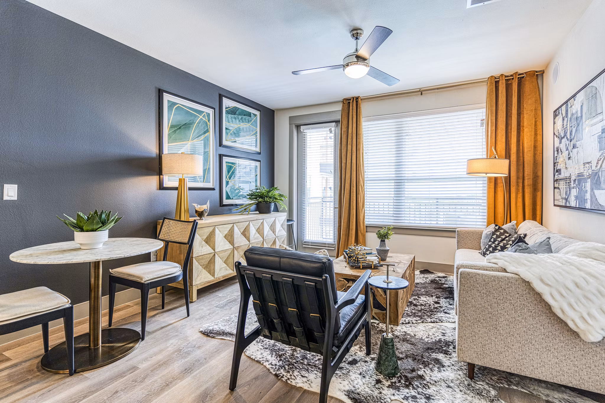 Spacious living room with modern decor at The Banks of Springdale Apartments, a luxury Greystar community