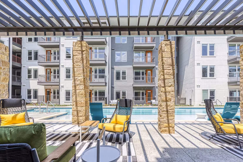 Pool patio offering luxury relaxation at The Banks of Springdale Apartments Enjoy stylish seating and serene atmosphere at this premier Greystar community