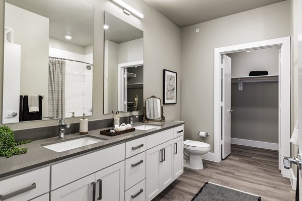 Modern bathroom with sleek fixtures at Urban East Apartments, offering luxury living in a prime location