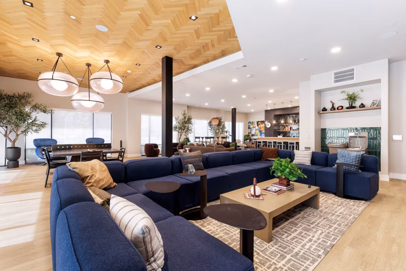 Clubhouse game room featuring modern decor and billiards at Urban East Apartments, Greystar luxury apartments community