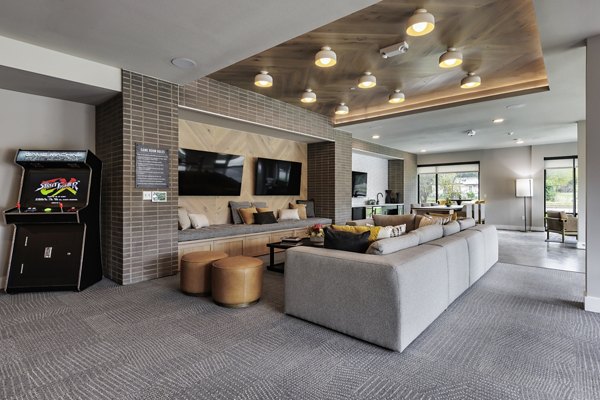 Clubhouse game room featuring modern decor and billiards at Urban East Apartments, Greystar luxury apartments community