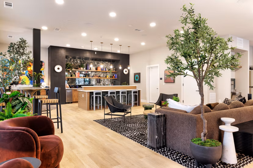 Clubhouse business center at Urban East Apartments featuring modern workstations and meeting spaces