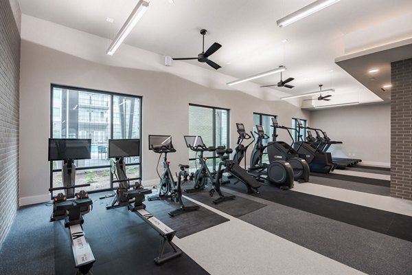 Modern fitness center with state-of-the-art equipment at Urban East Apartments in Greystar community