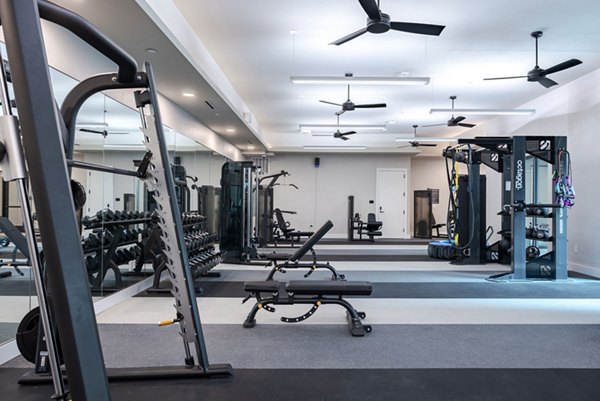 Modern fitness center at Urban East Apartments with state-of-the-art equipment for active living