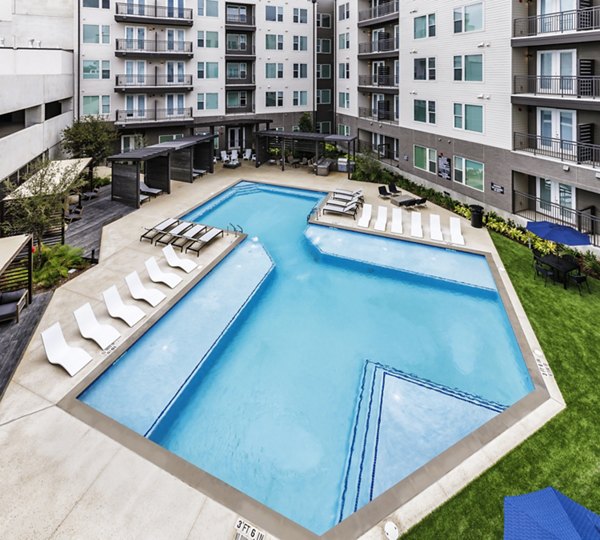 Luxury outdoor pool with sundeck at Urban East Apartments in vibrant community