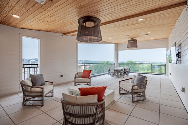 Lush courtyard with seating and gardens at Urban East Apartments offering a tranquil escape