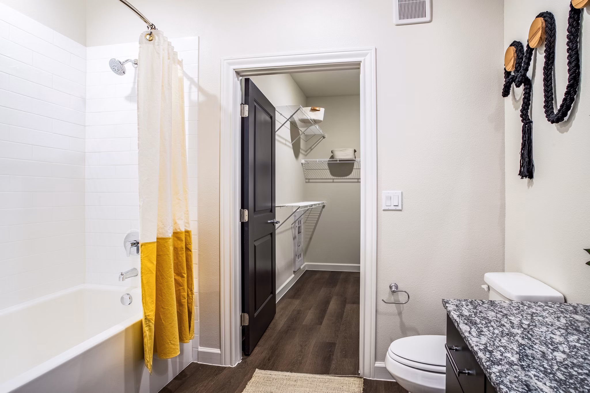 Bathroom featuring elegant fixtures and marble countertops in West End Apartments