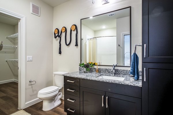 Modern bathroom with marble countertops and sleek fixtures in West End Apartments luxurious living