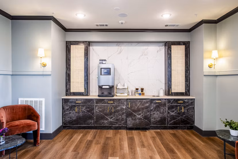 Elegant clubhouse lobby with modern decor at West End Apartments, offering luxury communal spaces in an upscale residential setting