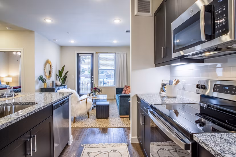 Modern kitchen with sleek cabinetry and stainless steel appliances at West End Apartments
