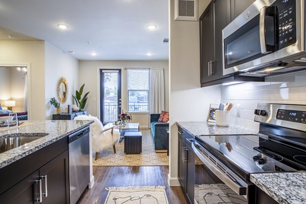 Modern kitchen with sleek cabinetry and stainless steel appliances at West End Apartments