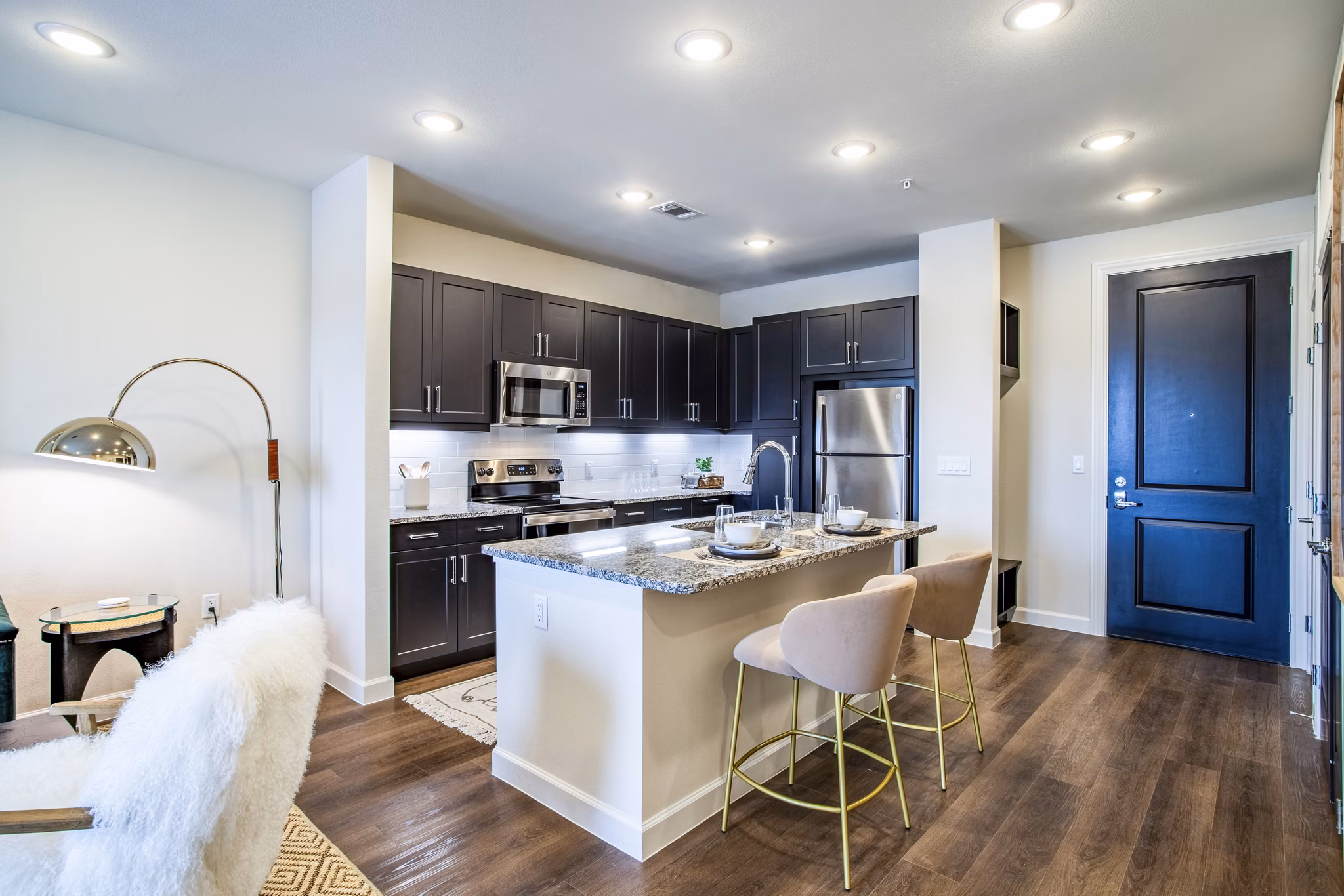 Dining room featuring modern decor and elegant lighting at West End Apartments