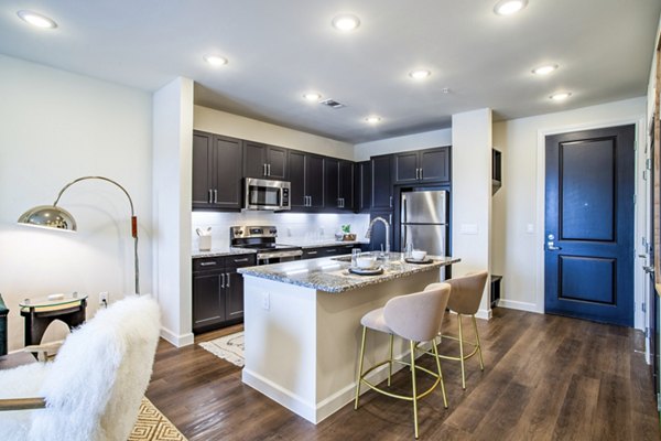 Dining room featuring modern decor and elegant lighting at West End Apartments