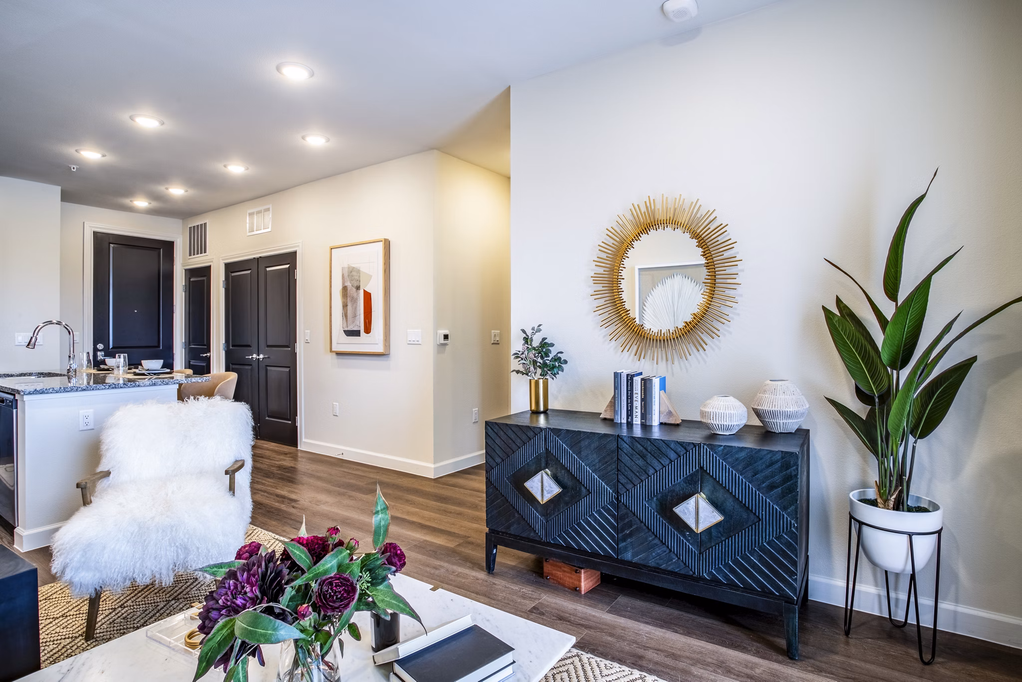 Inviting living room with contemporary furnishings and natural light at West End Apartments