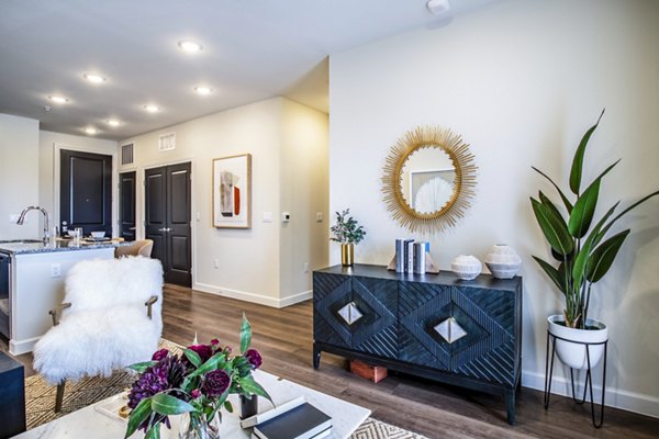Inviting living room with contemporary furnishings and natural light at West End Apartments
