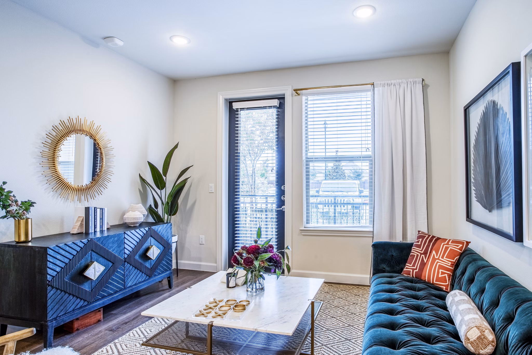 Cozy living room with modern furnishings in West End Apartments, ideal for relaxation and entertaining guests