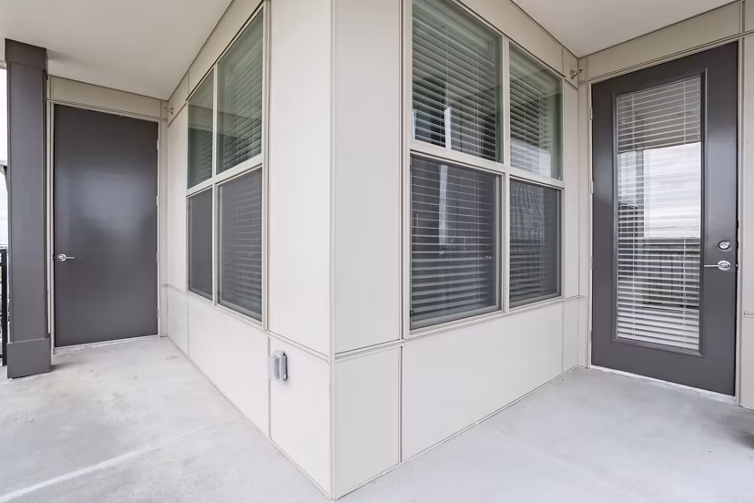 Elegant entrance of luxury West End Apartments showcasing contemporary design and neighborhood accessibility