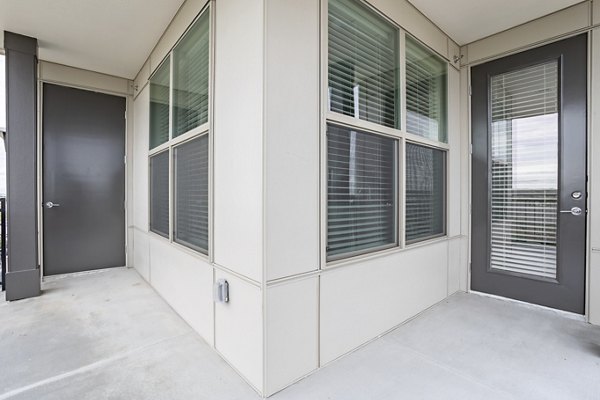 Elegant entrance of luxury West End Apartments showcasing contemporary design and neighborhood accessibility