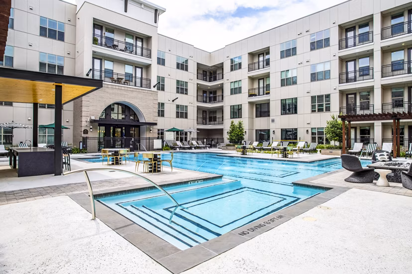 Sparkling pool with lounge chairs at West End Apartments, a luxury living community