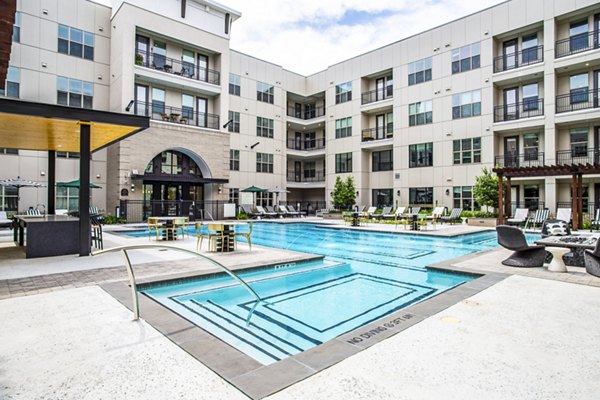Sparkling pool with lounge chairs at West End Apartments, a luxury living community