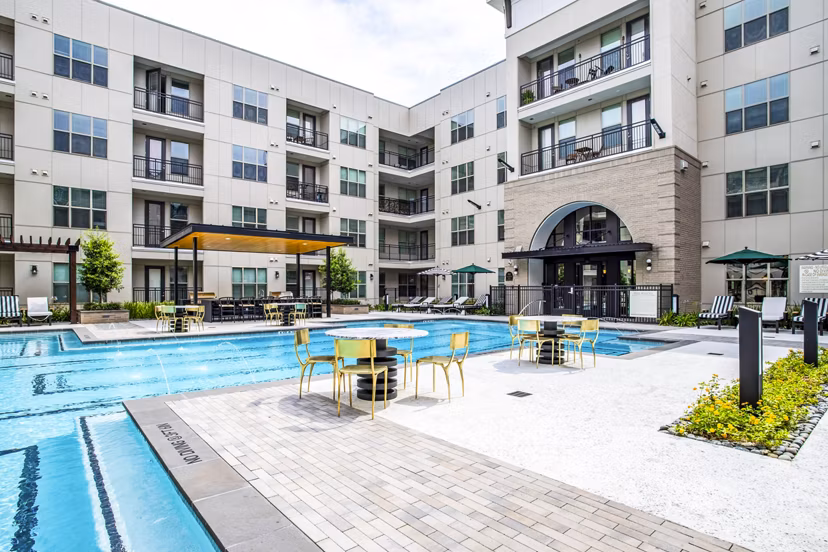 Elegant pool area with cabanas at West End Apartments, perfect for relaxation and leisure