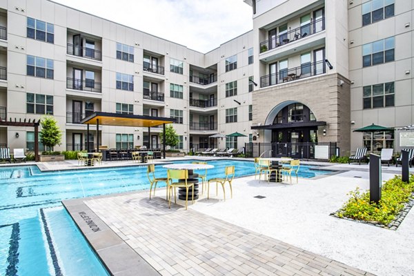 Elegant pool area with cabanas at West End Apartments, perfect for relaxation and leisure