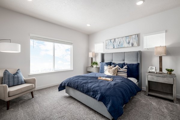 Cozy bedroom with modern decor at The Orchard Townhomes