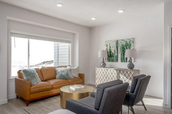 Spacious living room with contemporary decor in The Orchard Townhomes