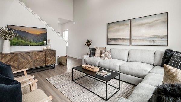 Spacious living room with modern decor in The Orchard Townhomes