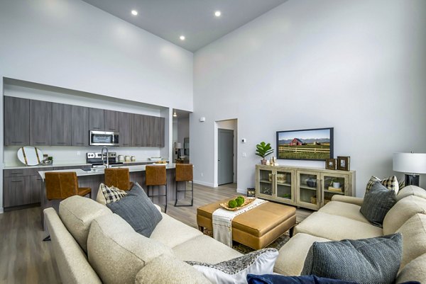 Spacious living room with modern furnishings in The Orchard Townhomes