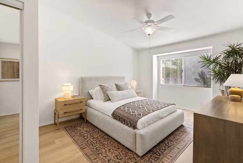 Cozy bedroom with stylish decor at St Moritz Apartments