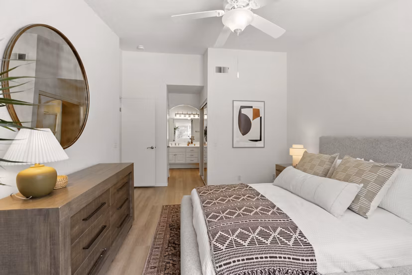 Cozy bedroom with elegant decor at St Moritz Apartments
