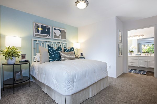 Bedroom featuring elegant design and cozy bed at St Moritz Apartments