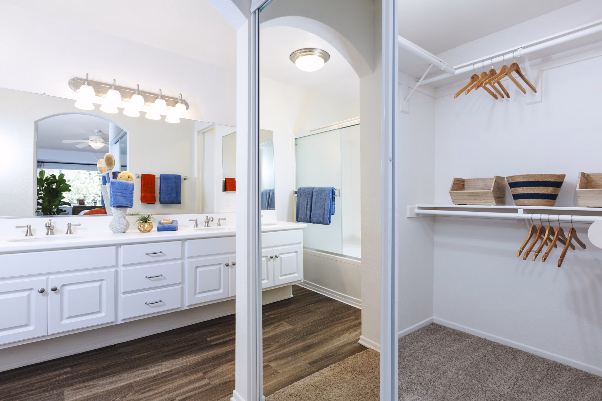 Bathroom closet with organized shelving in St Moritz Apartments