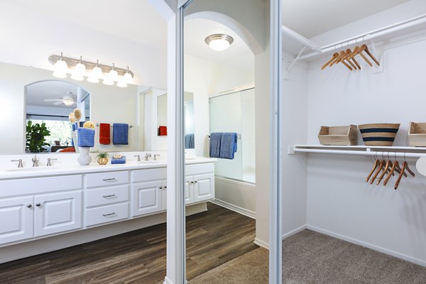 Bathroom closet with organized shelving in St Moritz Apartments