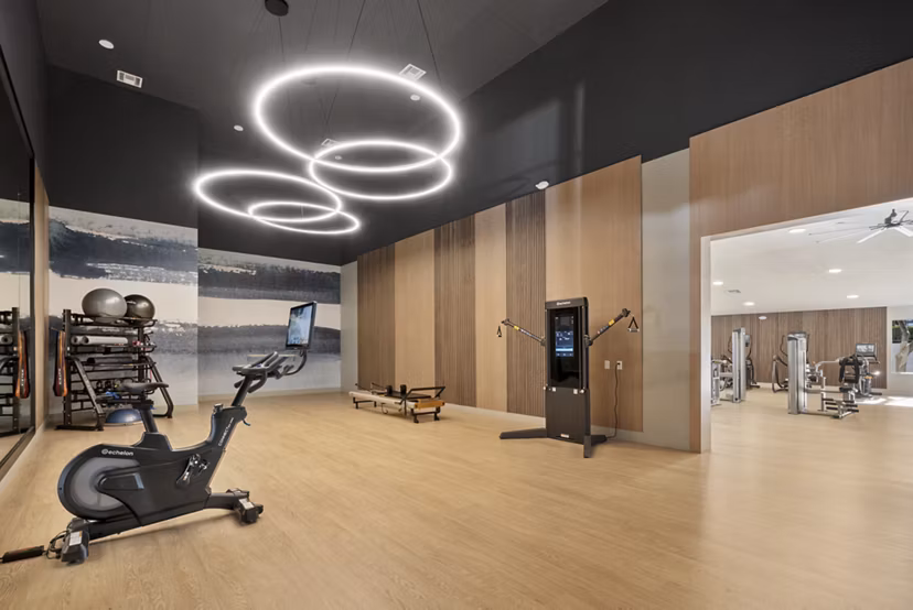 State-of-the-art fitness center with modern equipment at St Moritz Apartments