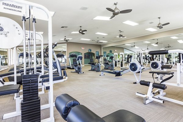 State-of-the-art fitness center with modern equipment at St Moritz Apartments
