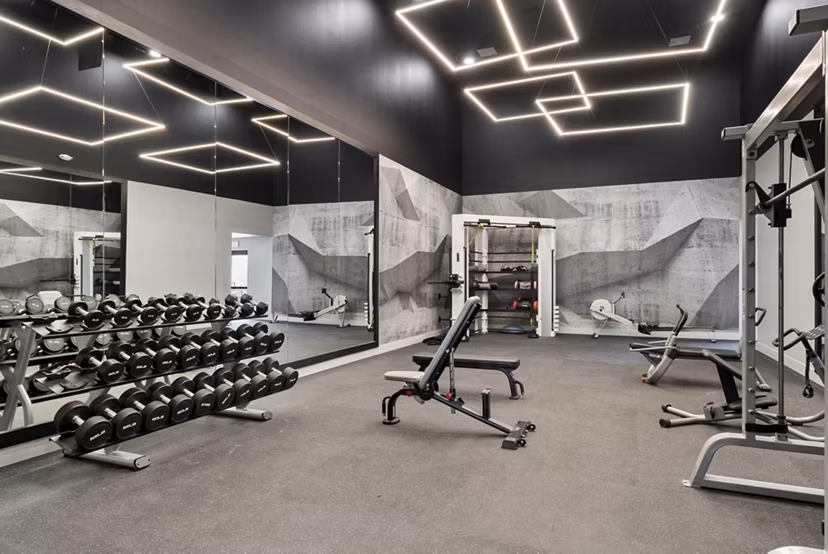 Modern fitness center with state-of-the-art equipment at St Moritz Apartments