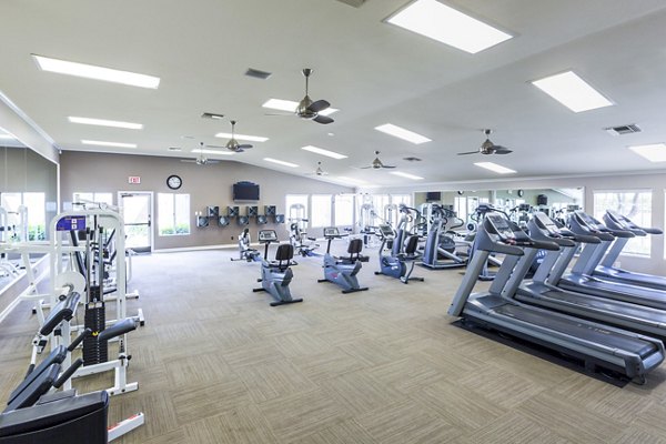Modern fitness center with state-of-the-art equipment at St Moritz Apartments