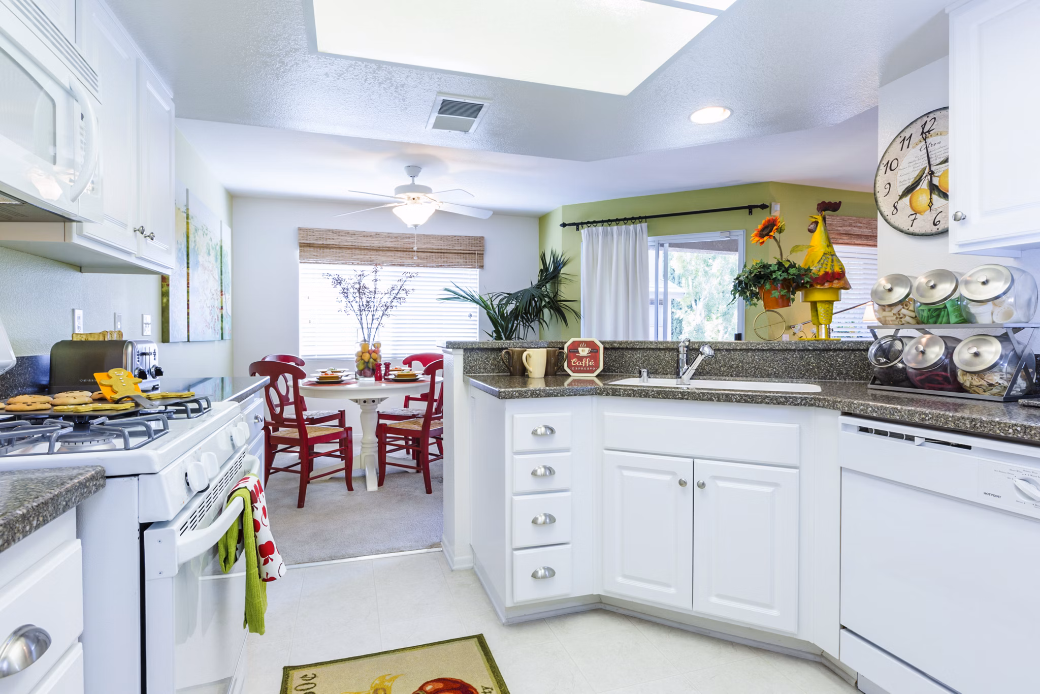 Spacious kitchen with island and stainless steel appliances at St Moritz Apartments