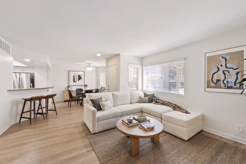 Spacious living room with elegant decor at St Moritz Apartments, offering luxury living in a stylish setting