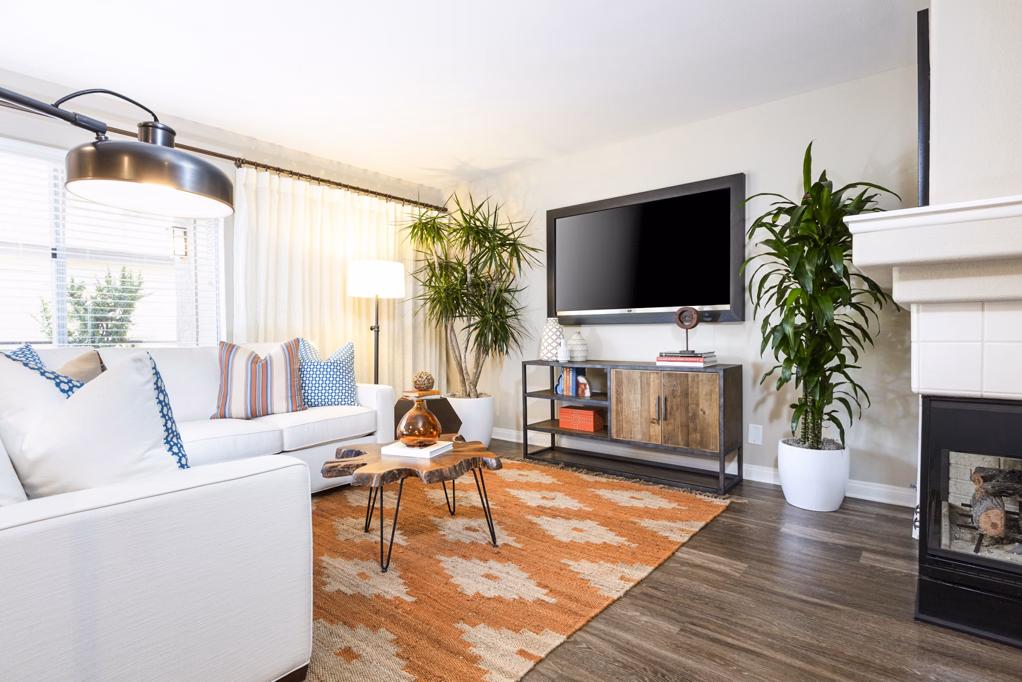Spacious living room with elegant decor at St Moritz Apartments, offering luxury living in a stylish setting