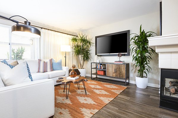 Spacious living room with elegant decor at St Moritz Apartments, offering luxury living in a stylish setting